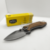 "Buck X75 Pakistan Knife - High-quality stainless steel blade with wooden handle, perfect for various cutting tasks."